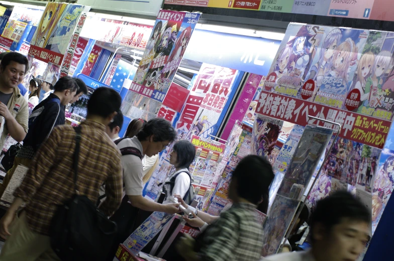 a group of people shopping in an asian market