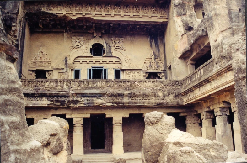 stone sculptures in front of a large building