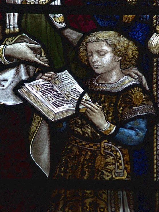 a stained glass depicts a medieval style religious scene