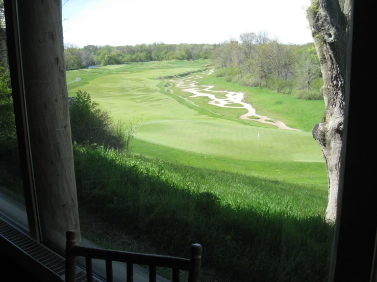 a view of a golf course through a window