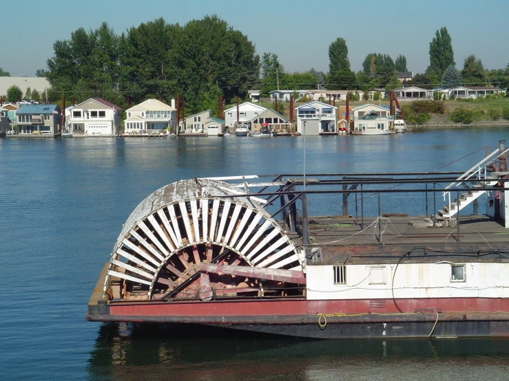 an old steam engine on the side of a river