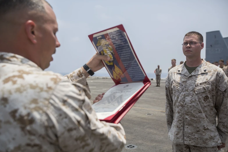 the man is looking at information in a folder