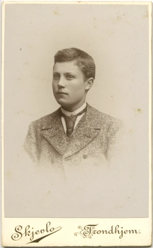 an old time sepia pograph of a young man