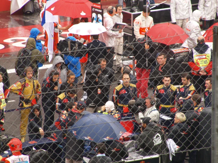 spectators sit in the stands at a baseball game