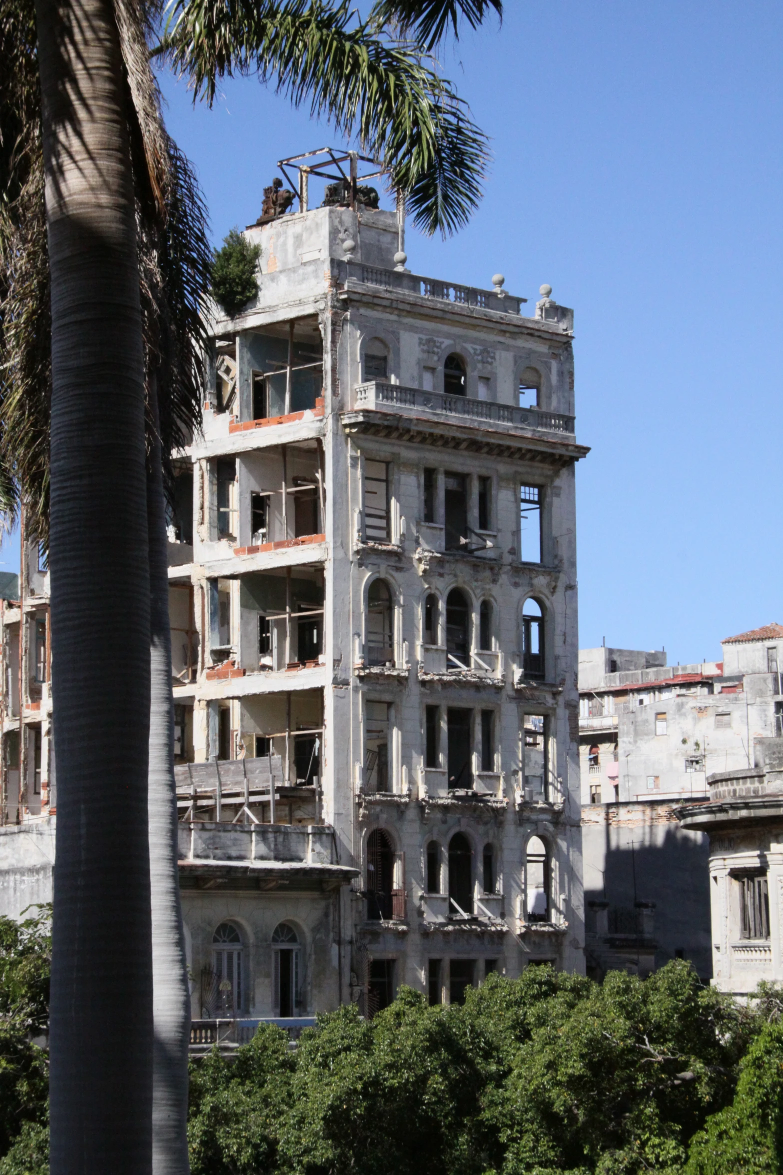 an old, run down building near the trees