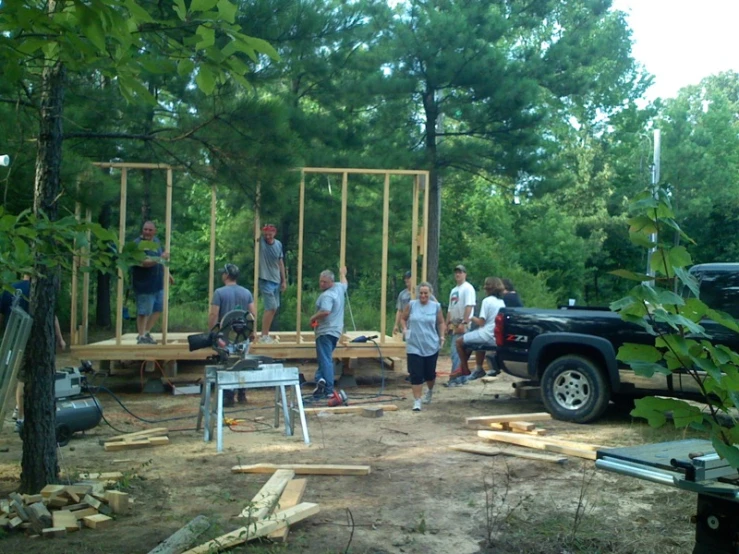 the men are building and talking on the phone