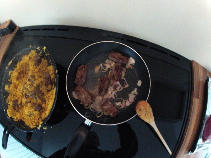 a pan filled with food sitting on top of a stove