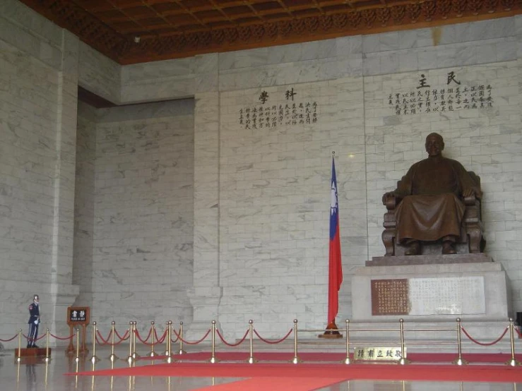 the inside of a large building that has a statue in front