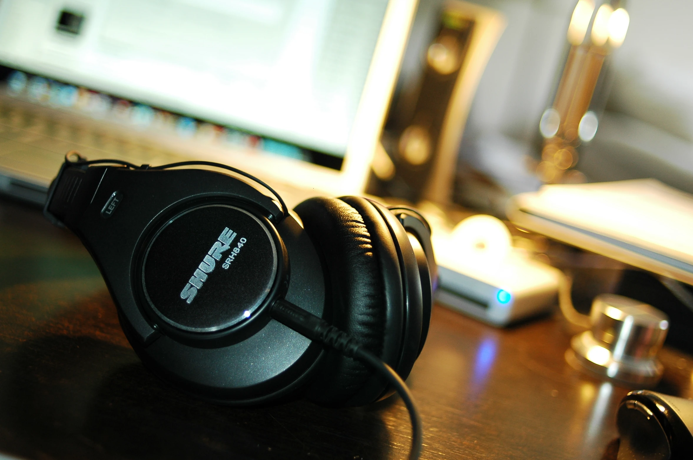 there is a close up picture of headphones on a desk