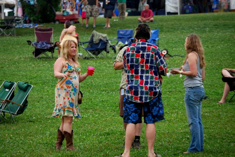 the people are chatting at the music festival