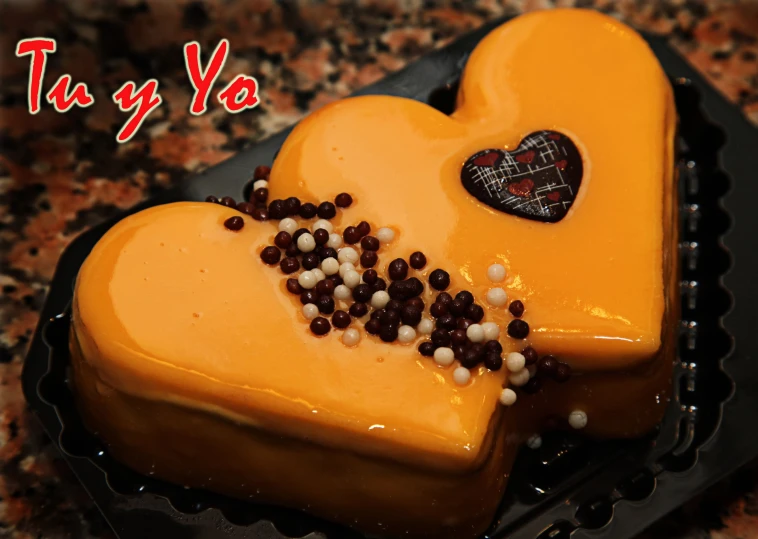 there is a heart cake with chocolate toppings
