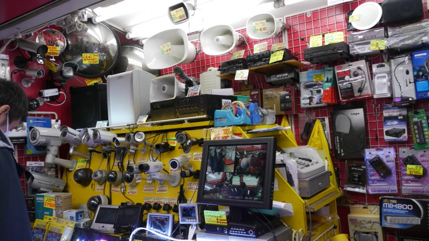 a man in front of some assorted computer components