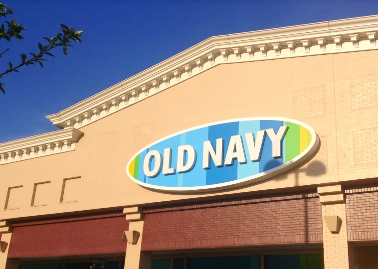 an old navy store front with windows on the building