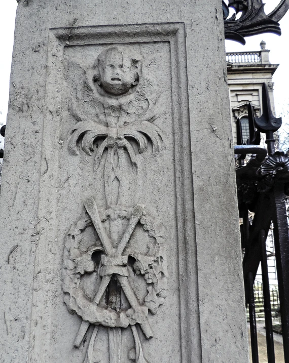 the stone carving above is depicting a statue