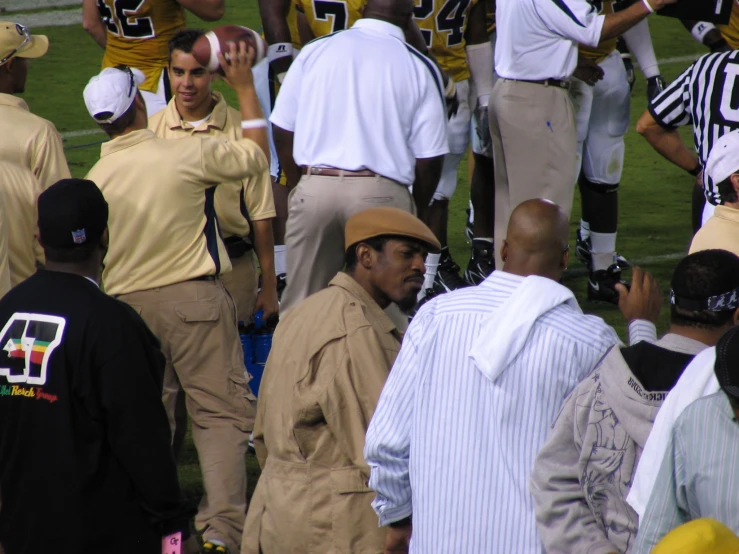 many people on a field and some men