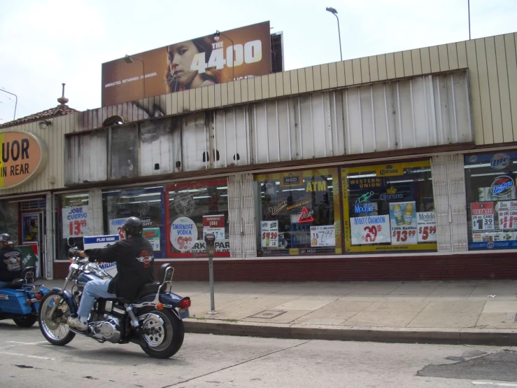 a motorcycle that is parked in front of a store