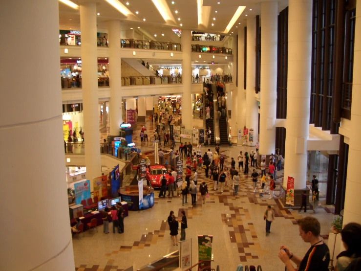 a view of the interior of a building with people walking around