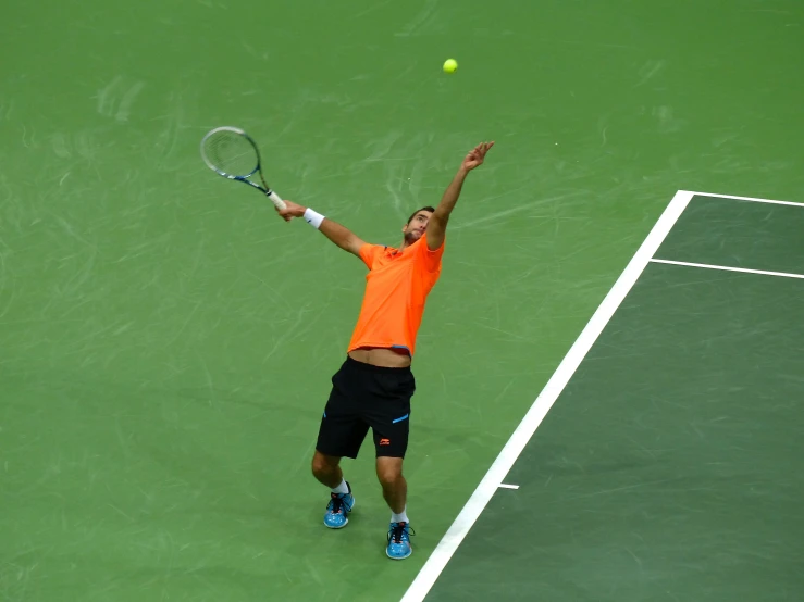 a man hitting a tennis ball with a racquet