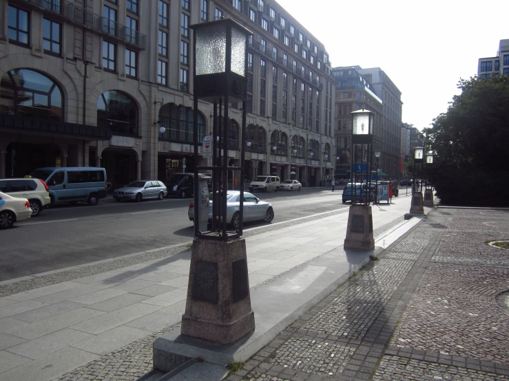 a po of a city street with many cars driving