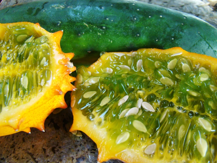 green and yellow fruit with seeds on them