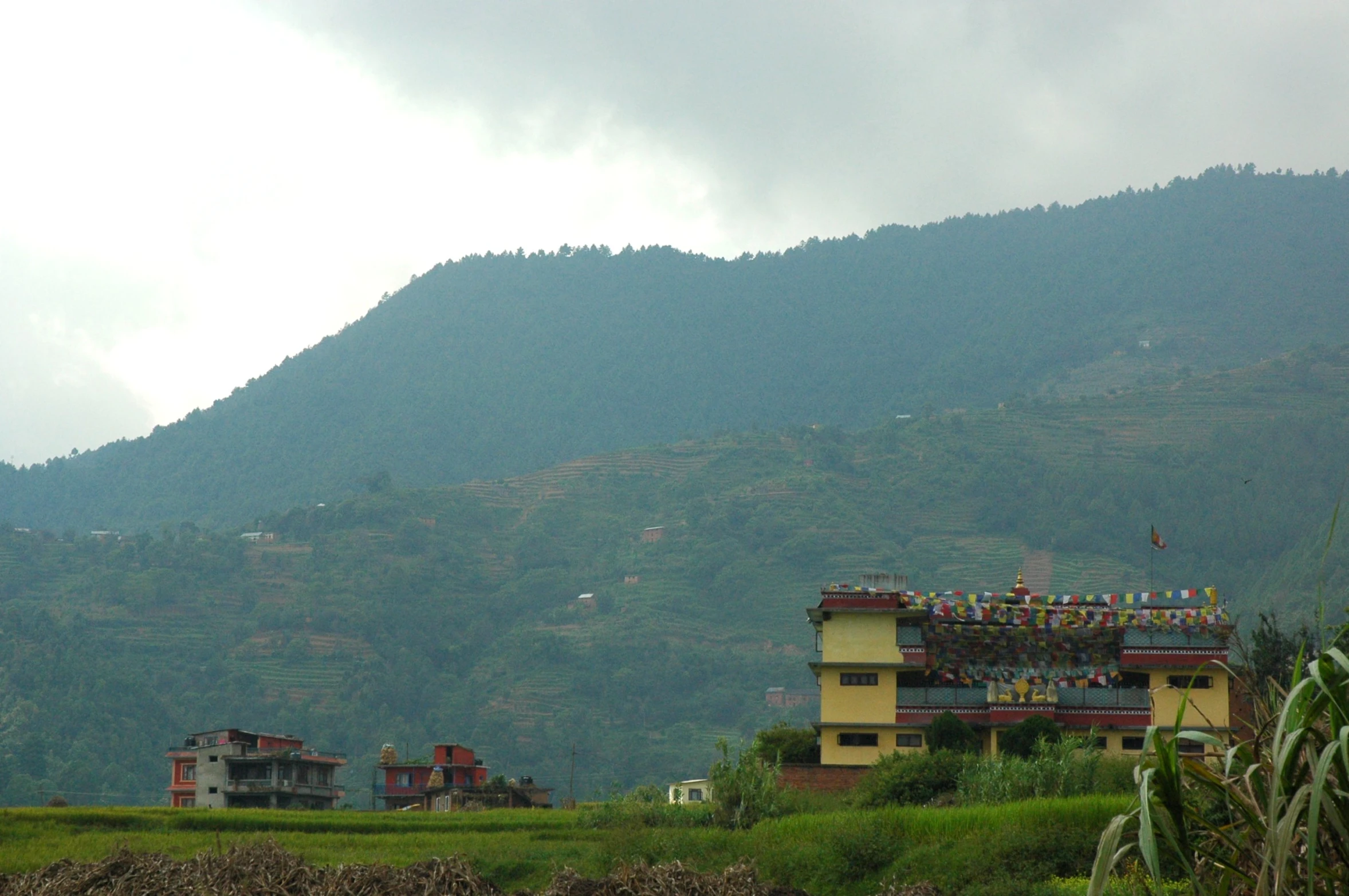 a view of a mountain side with buildings