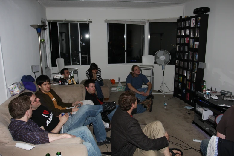 a group of young people sitting on top of a couch