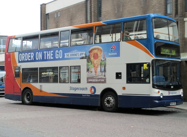 a double decker bus traveling down a street