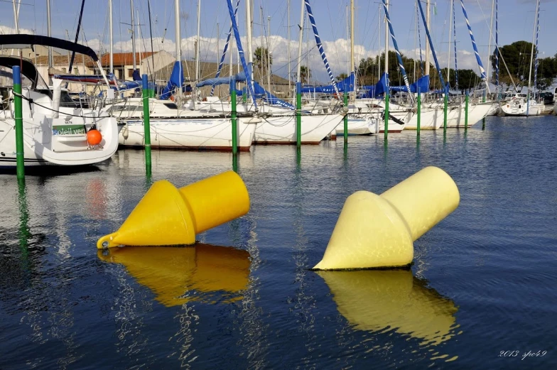 several boats sit in the harbor of a marina