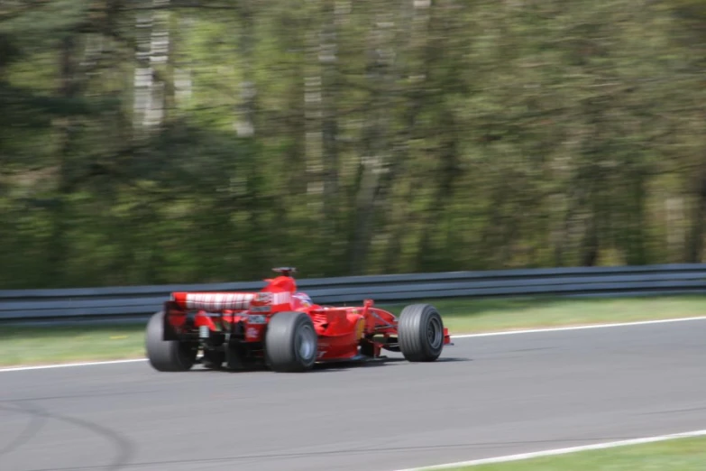 a large racing car driving down a road