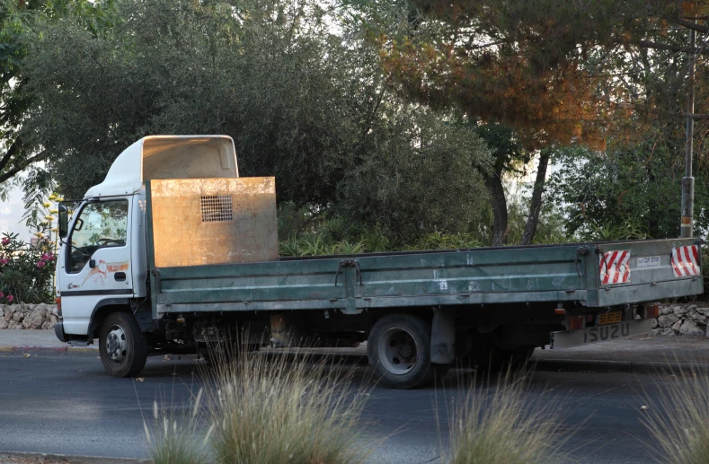 a delivery truck parked on the side of a street