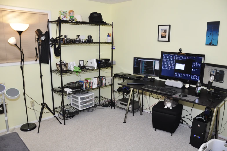 a work desk in the corner of a room