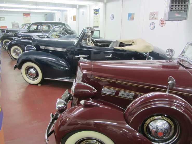 some classic cars parked next to each other