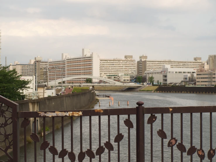 a view of a river and a city from a bridge