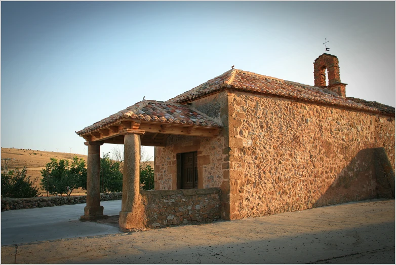 the building is made from stones and stucco