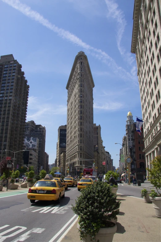 many cars move by on a city street