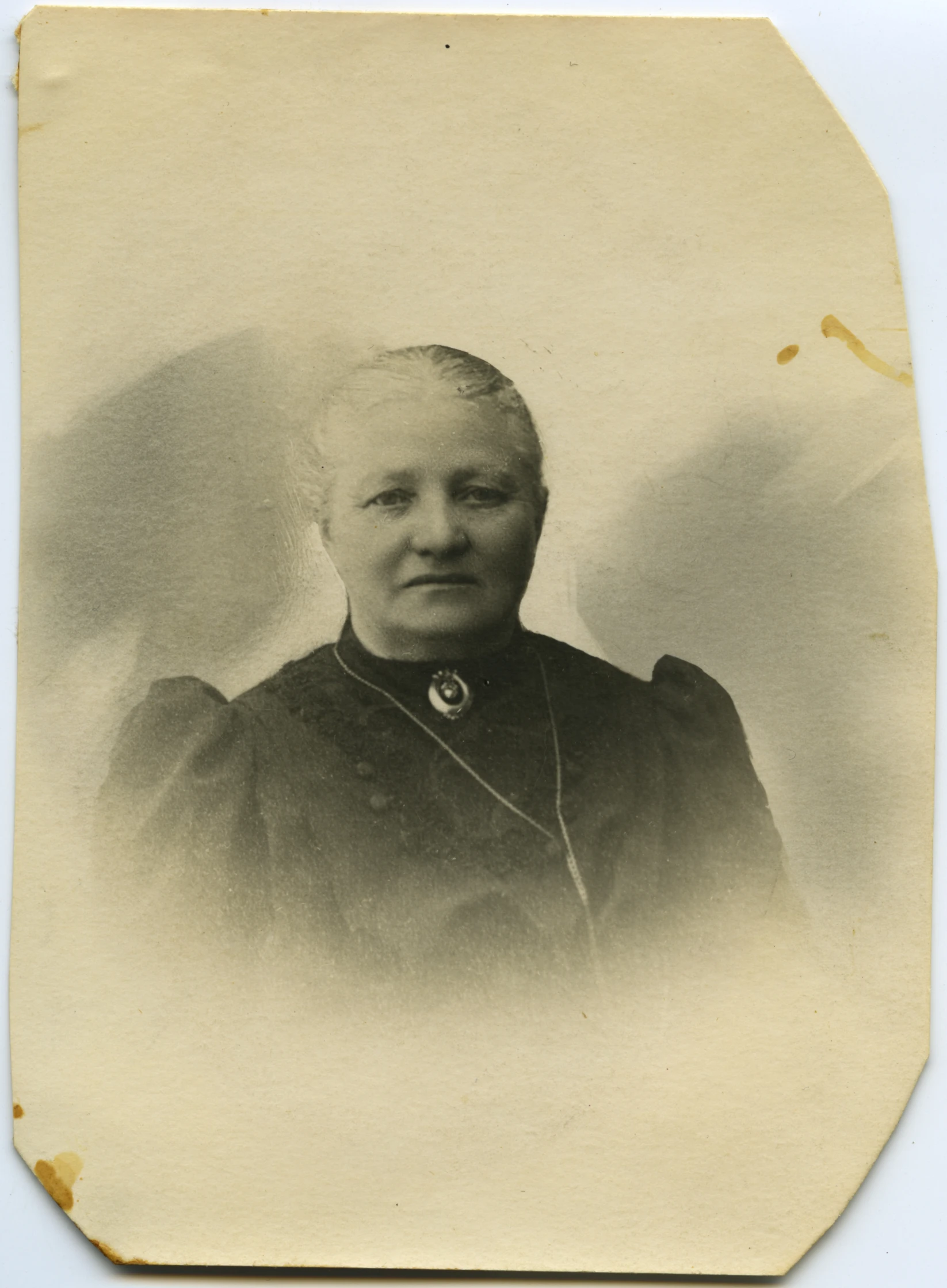 a sepia pograph shows a woman in a formal uniform