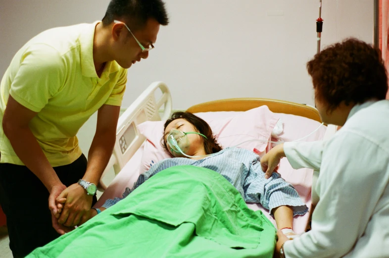 a man standing over an injured woman