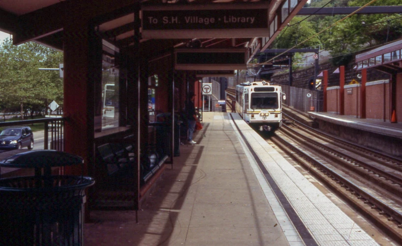 a train is pulling up to the station