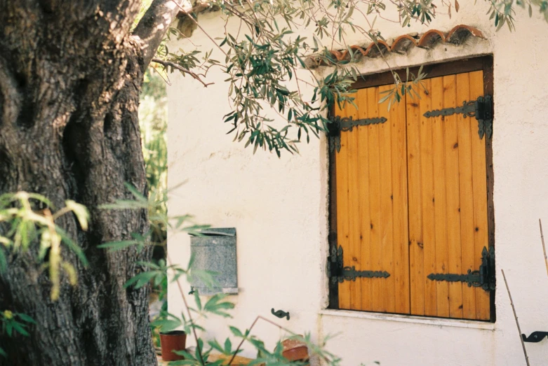 an old building with wooden doors and window frames