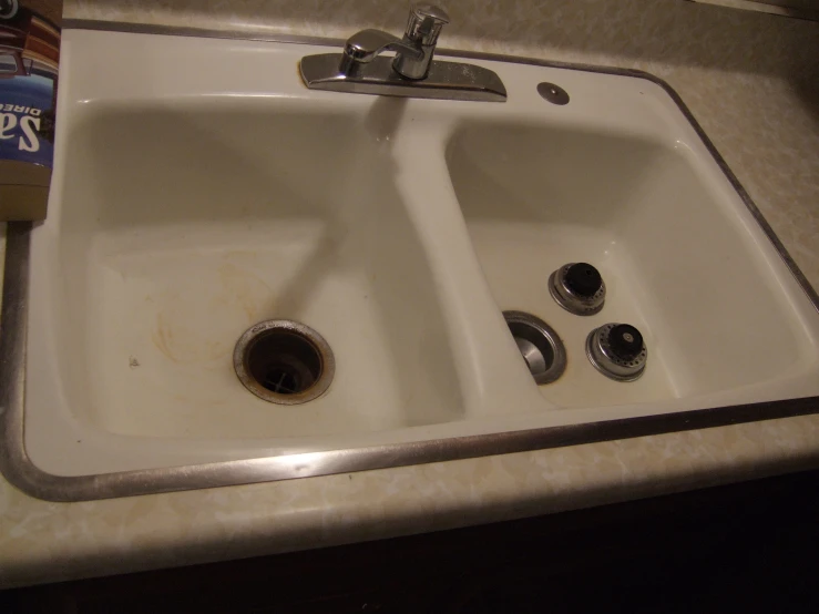 a close up of a sink and a package on the counter