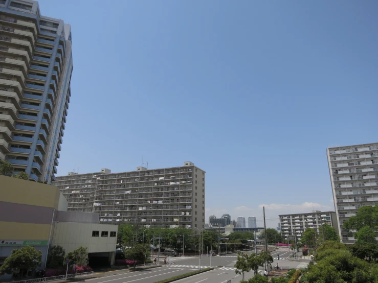 a view of some buildings across the street from the street