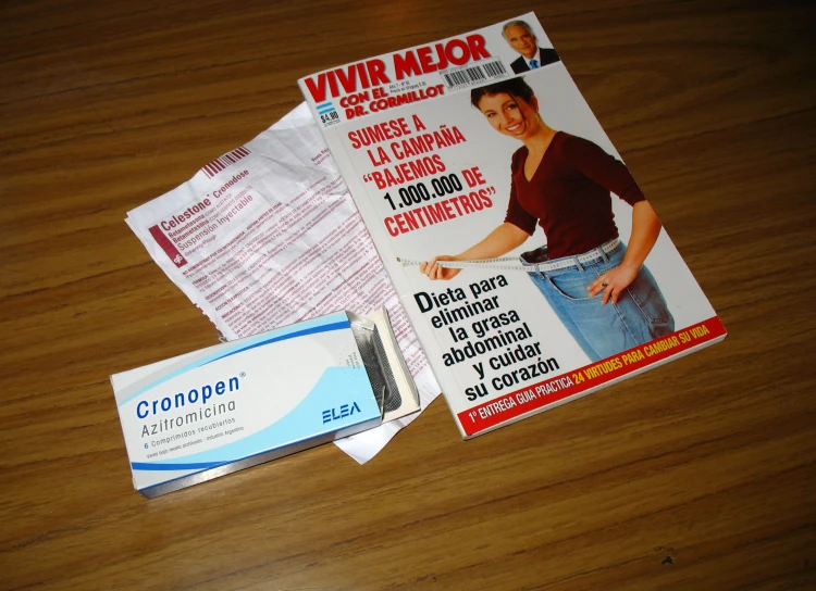 an envelope, razor and coupon sitting on top of a table