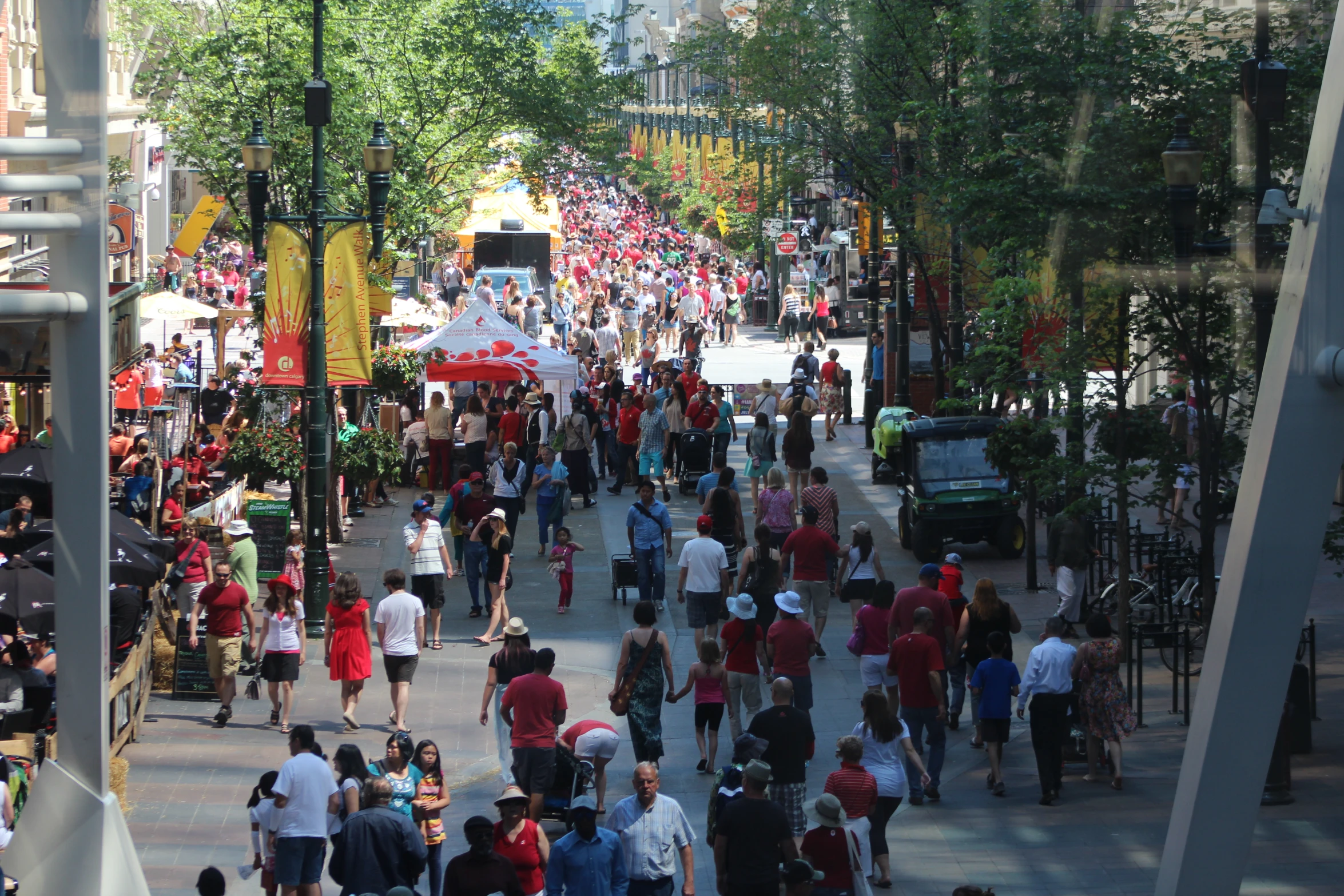 the street is full of people walking down the street