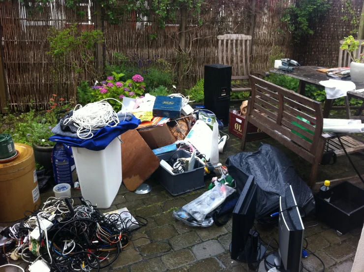 a small patio area filled with trash and clutter