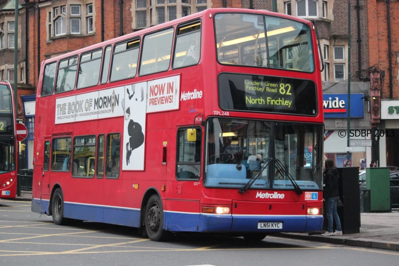 a double decker bus on the road near other cars