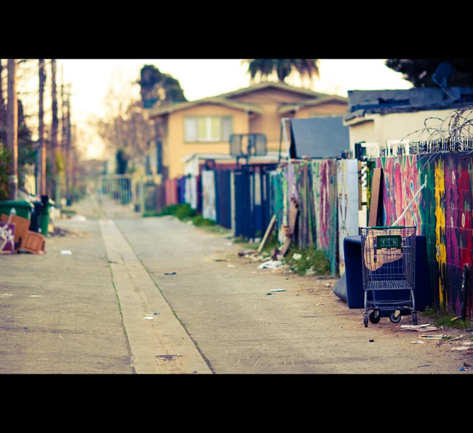 a long narrow city street next to several buildings