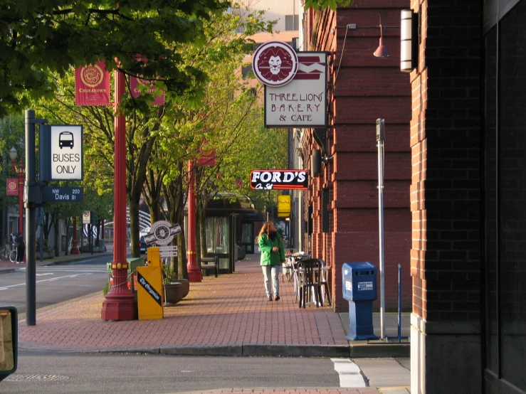 the sign says cheap cafe on a brick sidewalk