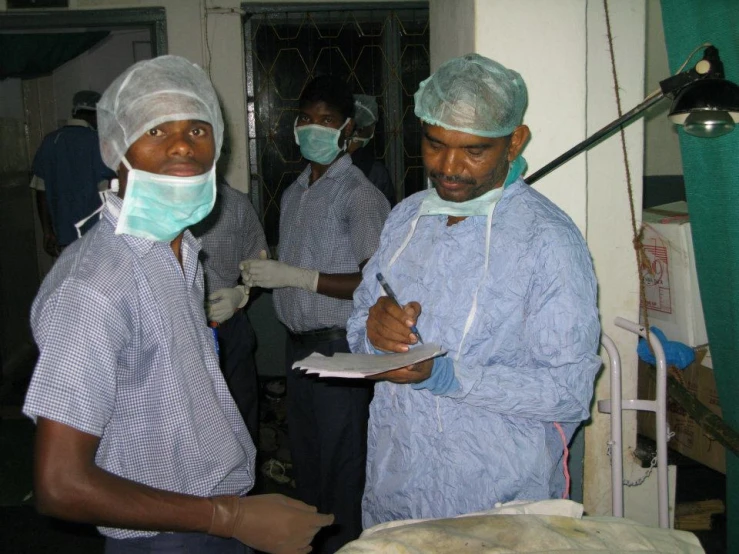 a group of doctors working on a patient