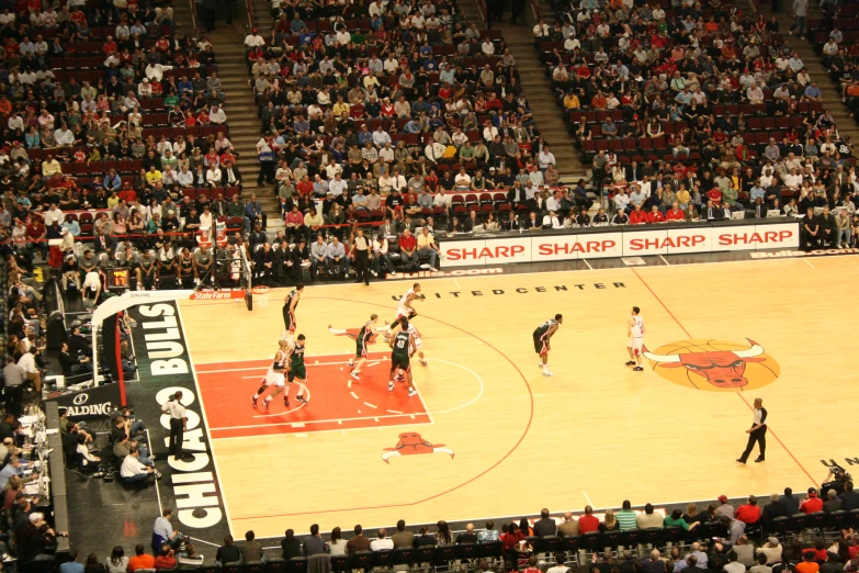 an overhead view of a crowd at a basketball game
