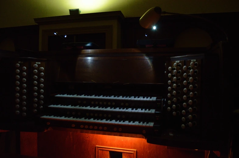 an old pipe organ with a black background